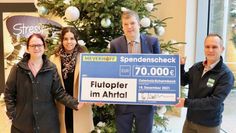 Annika Steffens, Melanie Blank, Jens Wendelken und Frank Weiberg setzen ein Zeichen für die Solidarität mit den Flutopfern im Ahrtal und Großraum Aachen.